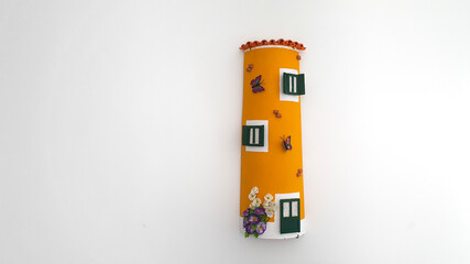 Handcrafted tile with a typical yellow Alentejo house painting. Portuguese handicraft. Indoor or outdoor decoration.