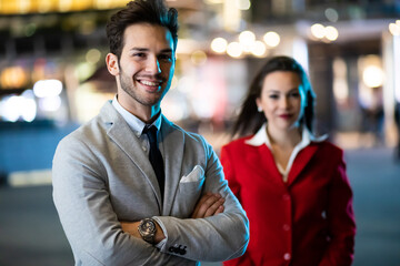 Business partners outdoor in a modern city at late evening