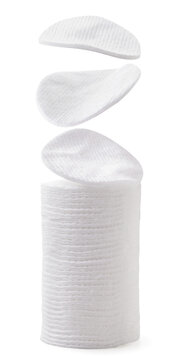 Cotton pads fall on the pile on a white background. Isolated
