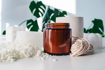 Handmade ecological and vegan soy wax candles with wooden wick. Amber and opaque container. Mock up, space for text.