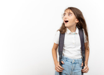 Student girl child with surprised facial expression on white background. education concept banner, background.