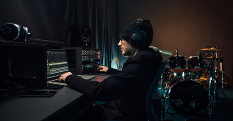 Sound engineer working in recording studio.