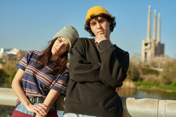 Cute young couple standing together outdoors