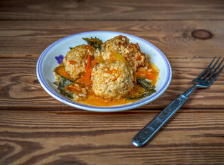 Breakfast with chicken meatballs with rice and vegetables on a light plate