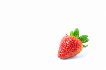 Single strawberry isolated on white background with copy space.