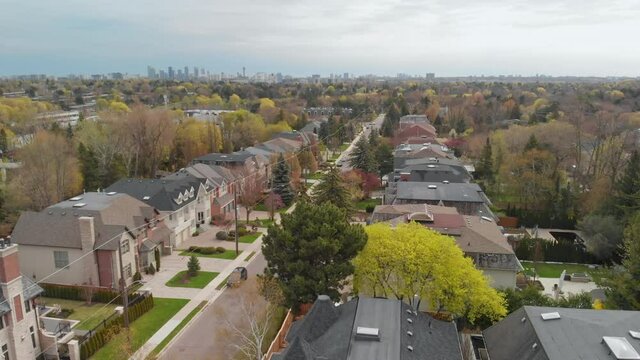An aerial shot descending over a residential suburban community in York Mills, Toronto.