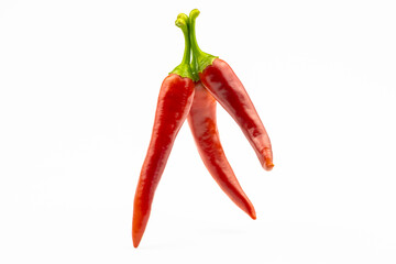 Three hot peppers isolated on a white background.