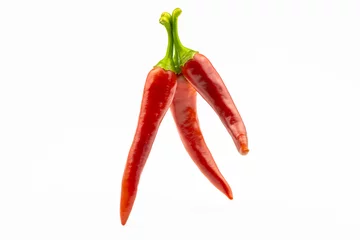 Fotobehang Three hot peppers isolated on a white background. © Andrii