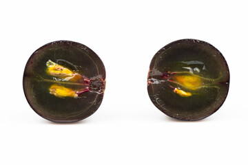Two sliced grapes isolated on a white background.