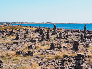 Stone pebble tower next to the sea shore