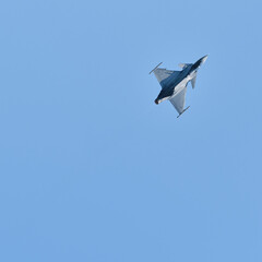 Fighter in flight up in the sky
