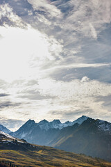 landscape of mountains with clouds and skies