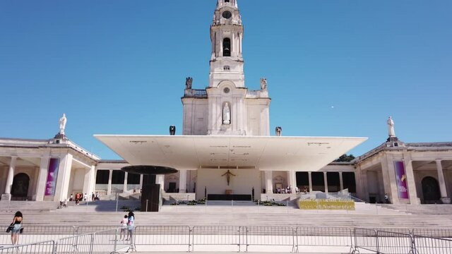 Fatima, Portugal, August 21, 2021: TILT SHOT - The Basilica of Our Lady of the Rosary of Fatima stands at the place where the three shepherds were playing by "building a small wall" on May 13, 1917.