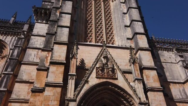 Batalha, Portugal, August 21, 2021: TILT SHOT - The Transept Portal of the Batalha Monastery. Portugal. UNESCO World Heritage Site.