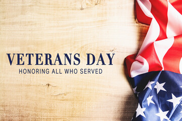 Fototapeta na wymiar Veterans day. Honoring all who served. American flag on wooden background