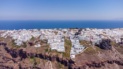 town on the cliffs  from the drone . Thira Santorini Greece