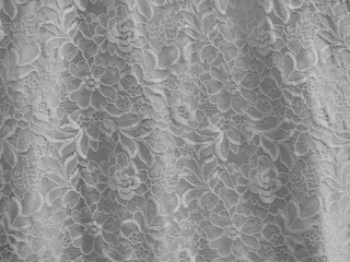 Lace. A closed up details of lace fabric background in gray. Grey lace texture fabric for lady lingerie.