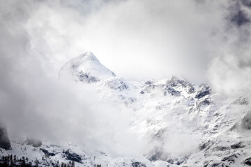 mountain peak in clouds durinf winter