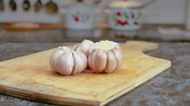 garlic on the table, garlic cloves, cutting board, in the kitchen