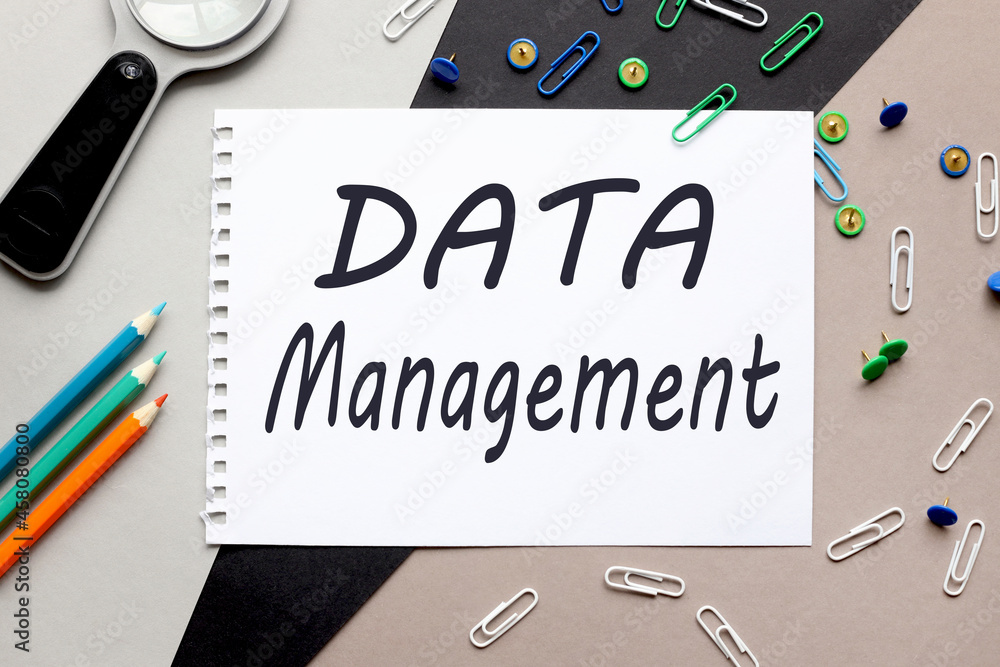 Poster data management. top view of notepad sheet mockup with copy space. surrounded by stationery on a thr