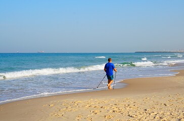 person walking on the beach