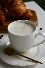 cup of coffee and croissant