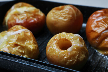 baked apples on a baking sheet