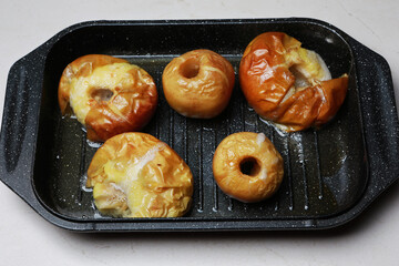baked apples on a baking sheet