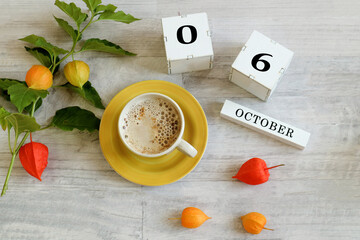 Calendar for October 6 : the name of the month in English, cubes with the numbers 0 and 6, a yellow...