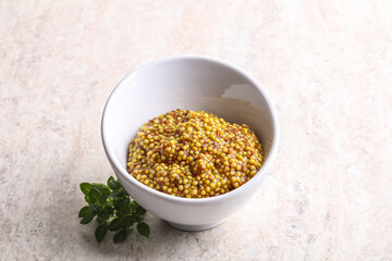 Grain mustard sauce in the bowl