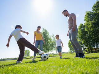 Parents and kids playing soccer