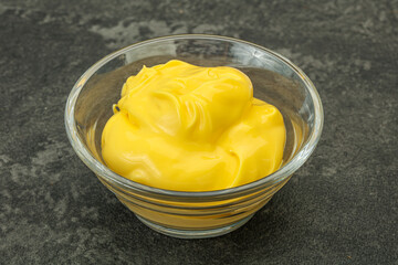 Natural cheese sauce in the bowl