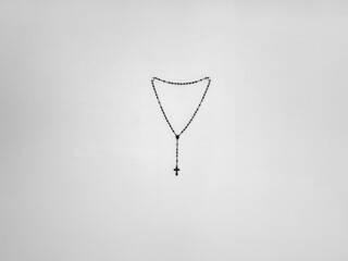 a rosary hanging on a wall