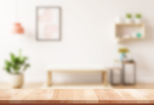 empty brown wooden table for product display montage with blur living room interior