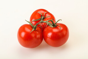 Red bright ripe tomato branch