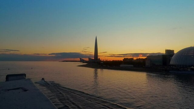 Hyperlapse video overlooking the bay and the Lakhta business center at sunset, Russia, St. Petersburg.