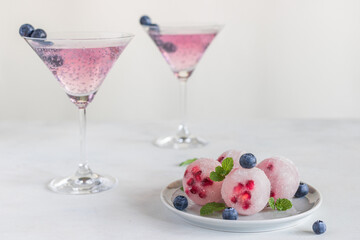 Fruit drinks decorated with fresh fruit. Summer alcoholic drinks. Fruit sorbet. Grape jelly with fruit.