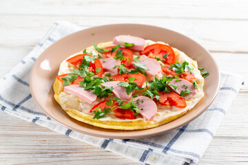 Cooking an egg roll. Popular egg roll with cheese and tomatoes