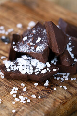 Selective focus. Dark chocolate with sea salt.