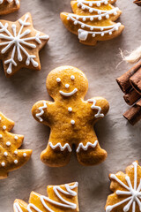 Gingerbread man and other Christmas cookies along with cinnamon