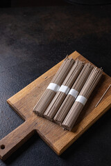 soba buckwheat raw noodles ready to cook meal snack on the table copy space food background 