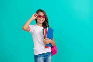 back to school. knowledge day. education. kid in glasses hold copybook. september 1.