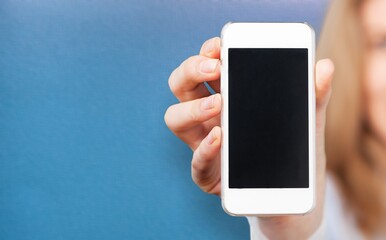 Young girl show empty smartphone with positive expression,