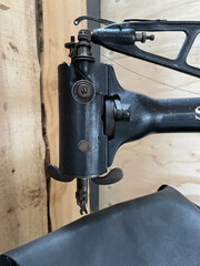 Vertical shot of a sewing machine for leather