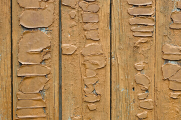 cracked brown paint on the walls