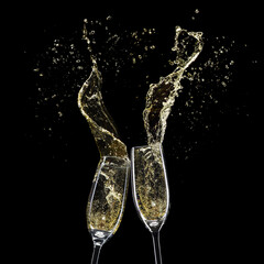 Glasses with champagne splashes