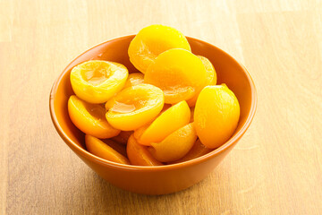 Fototapeta na wymiar Canned apricot – sweet light dessert