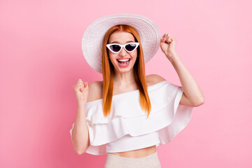 Photo of charming young happy pretty woman winner good mood smile isolated on pastel pink color background