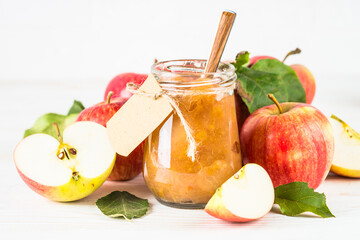 Apple jam with fresh apples on white background. Healthy sweets, homemade.