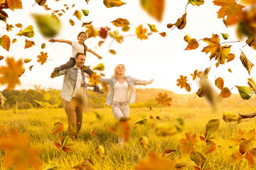happy beautiful family of five on a walk in the autumn against the background of yellow leaves